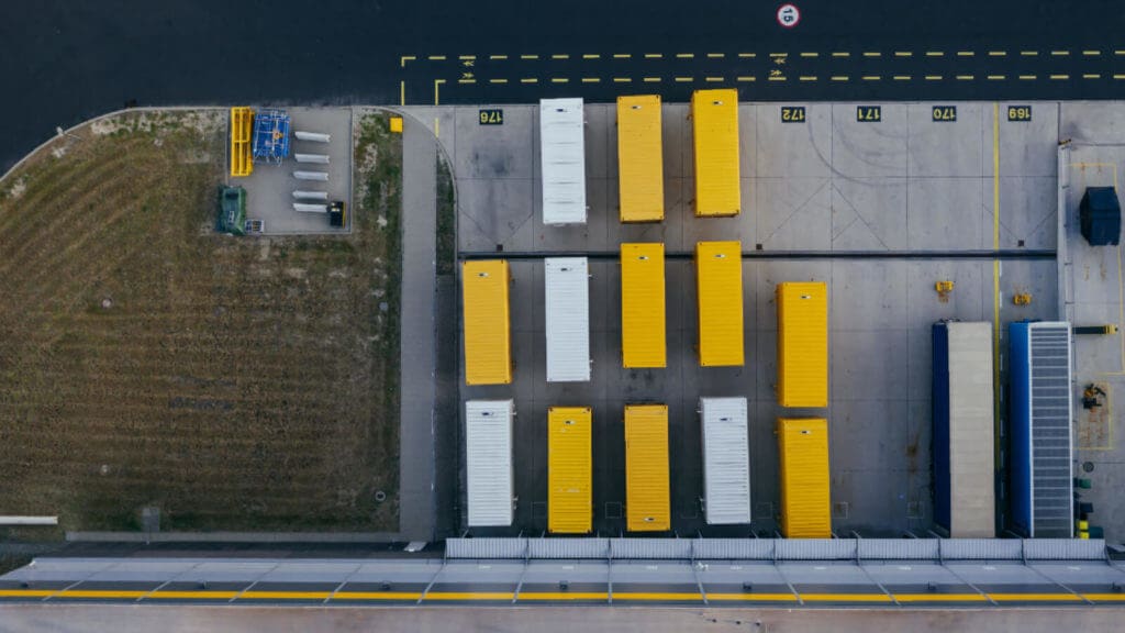 An overhead picture of cargo containers at a loading dock
